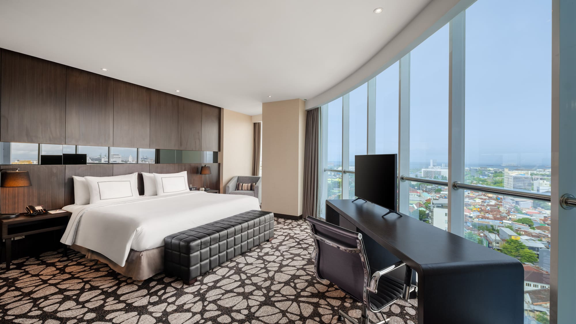 a room with a bed and a desk