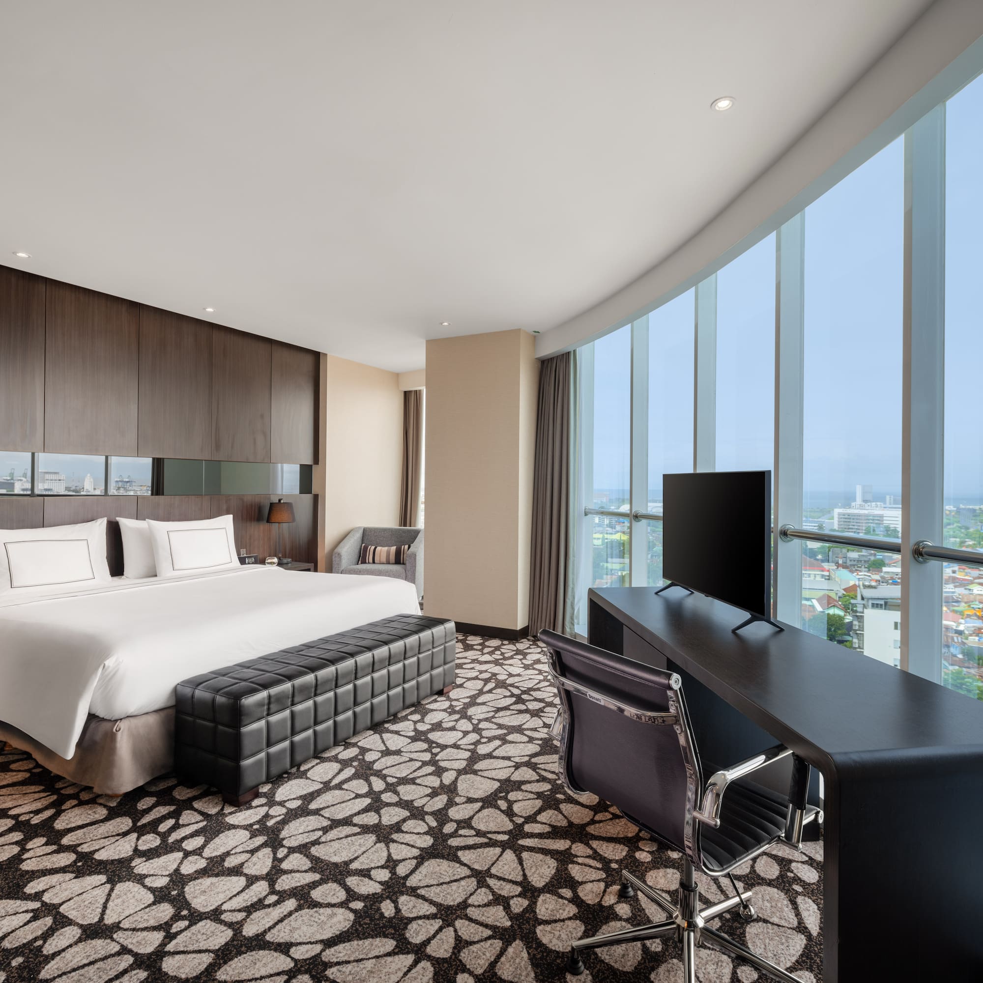 a room with a bed and a desk