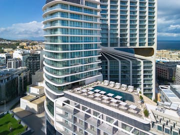 a group of buildings with a pool in the middle