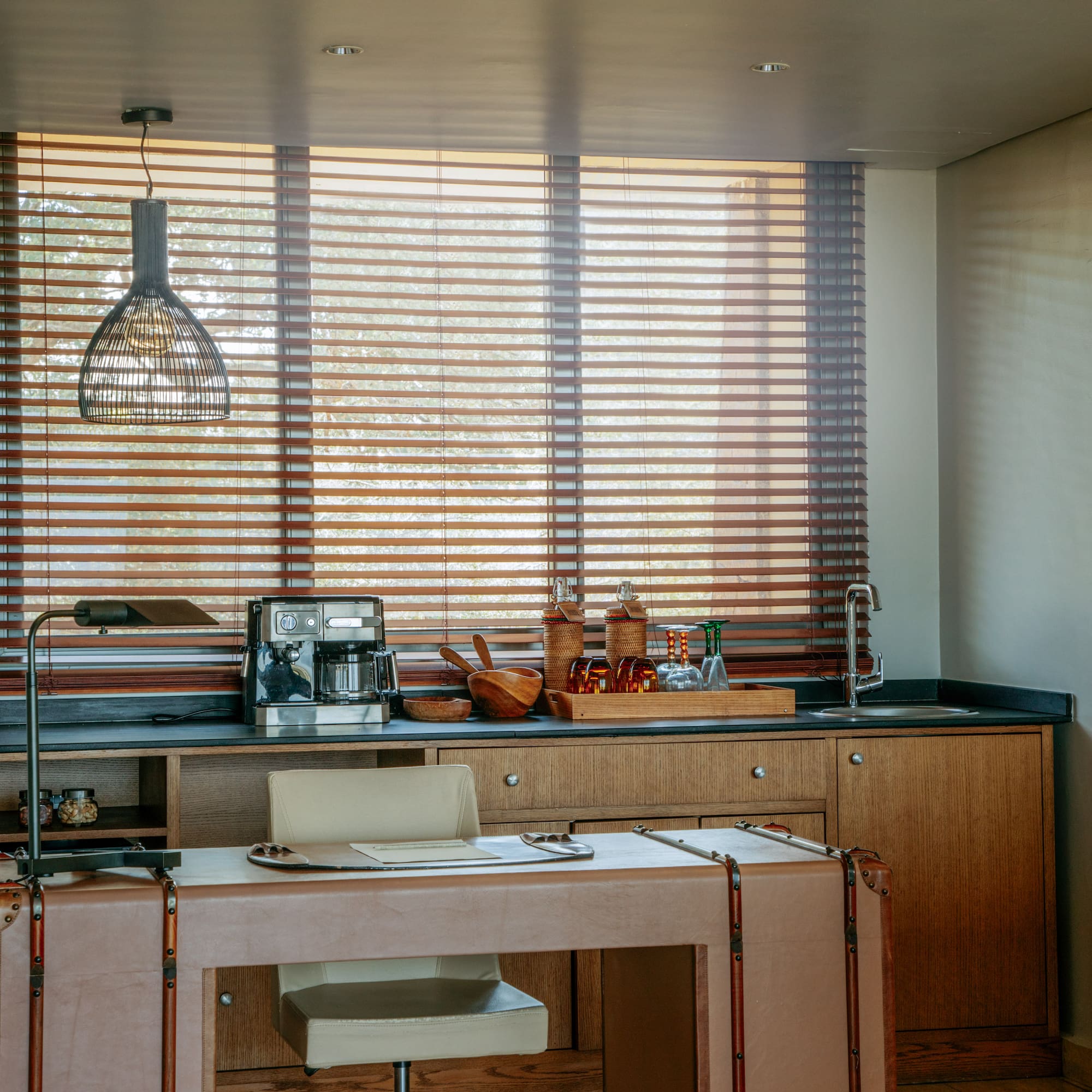 a kitchen with a table and chairs