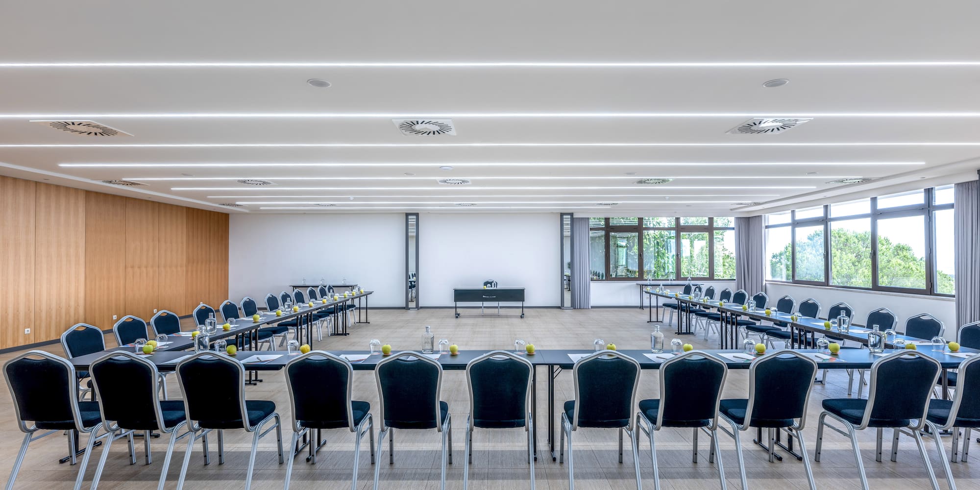 a room with many tables and chairs