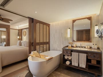 a bathroom with a bathtub and a mirror