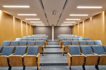 a room with blue chairs and a carpet