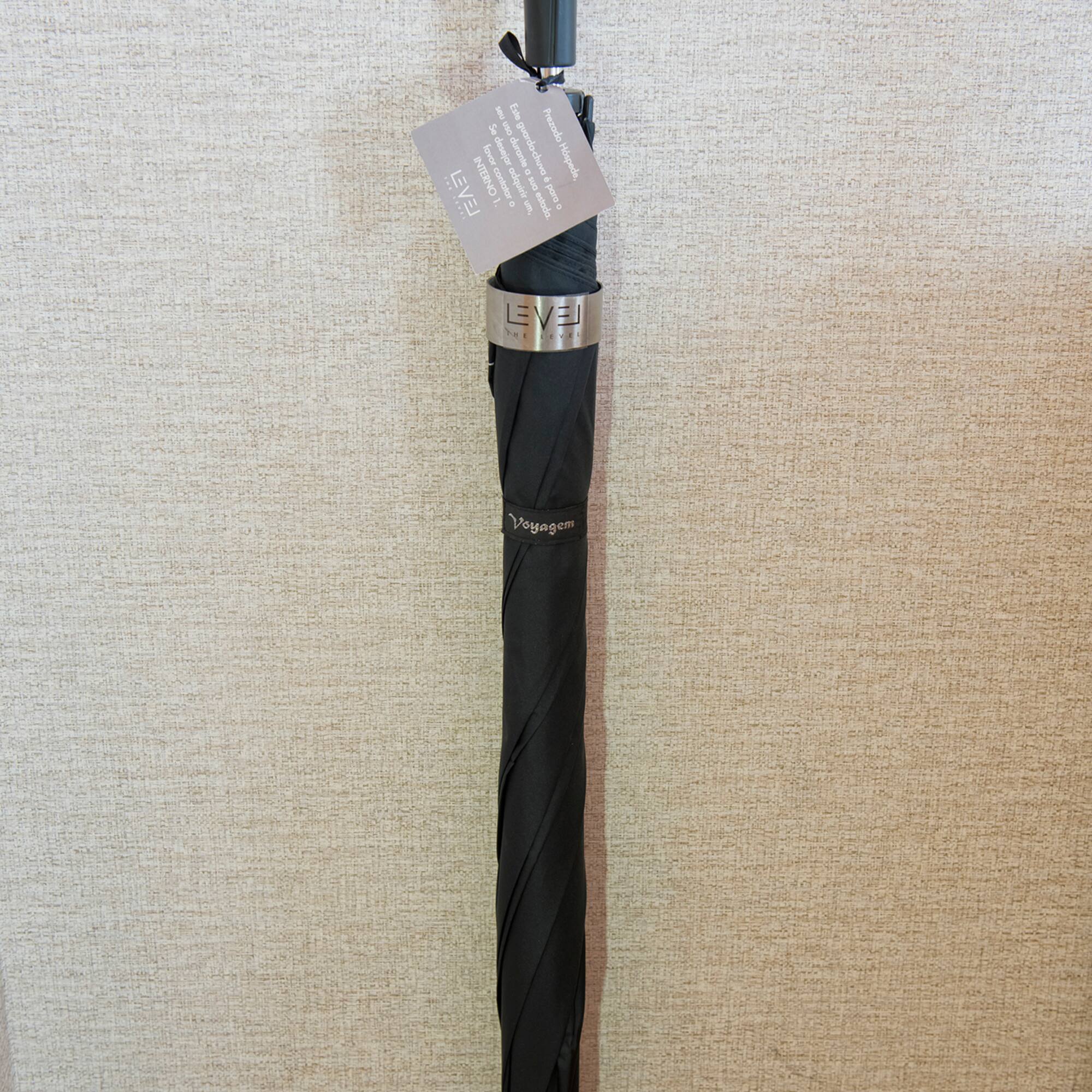 a black umbrella with a tag on it