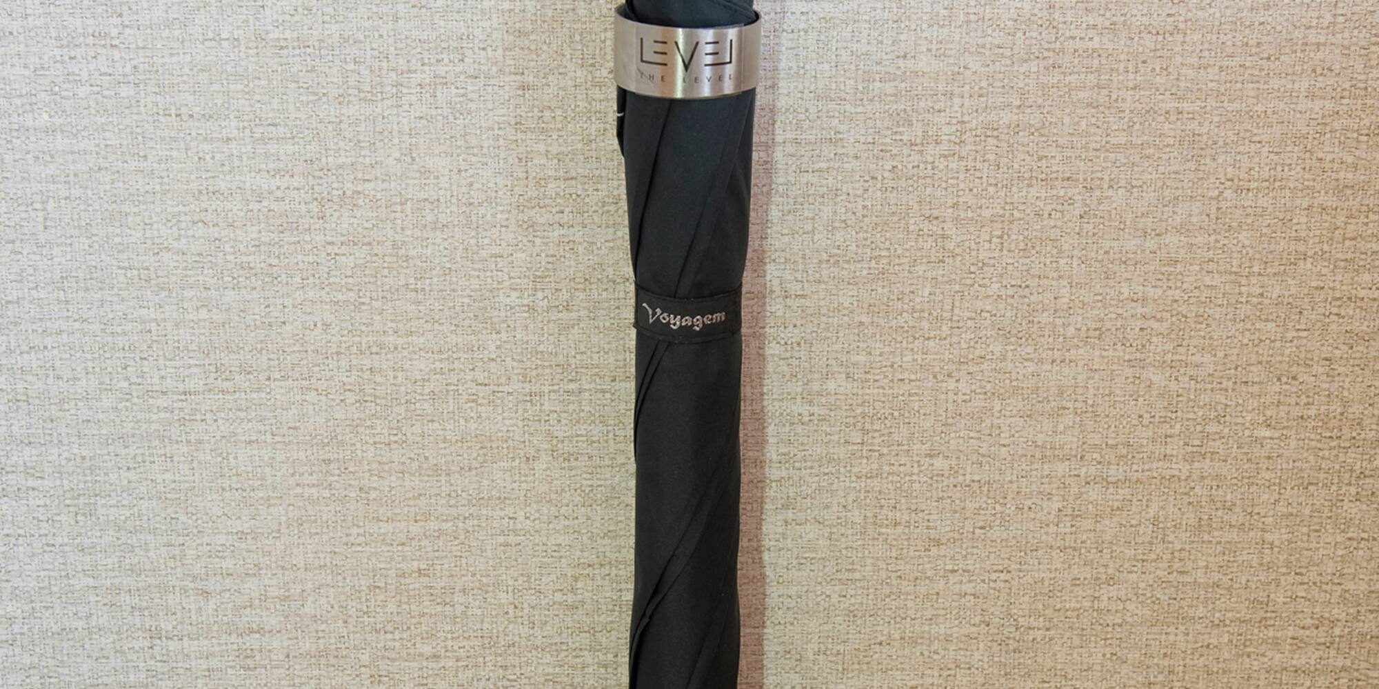 a black umbrella with a tag on it