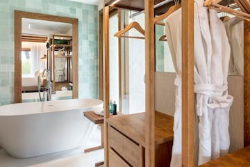 a bathroom with a bathtub and a bathtub