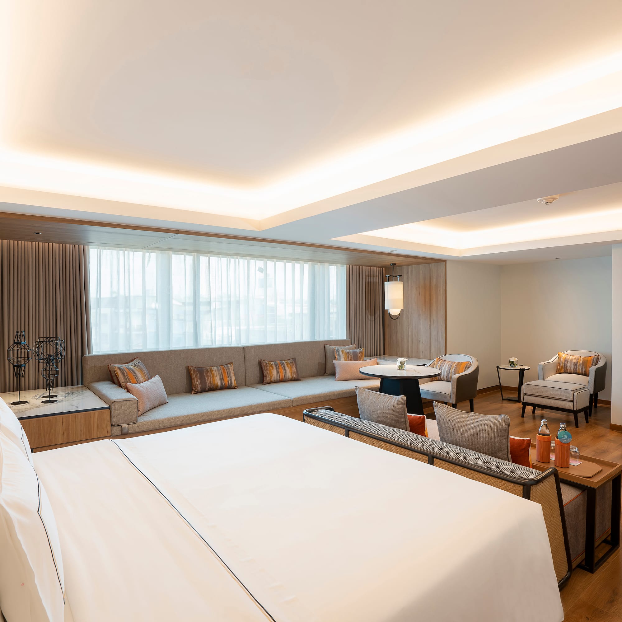 a room with a large bed and a couch