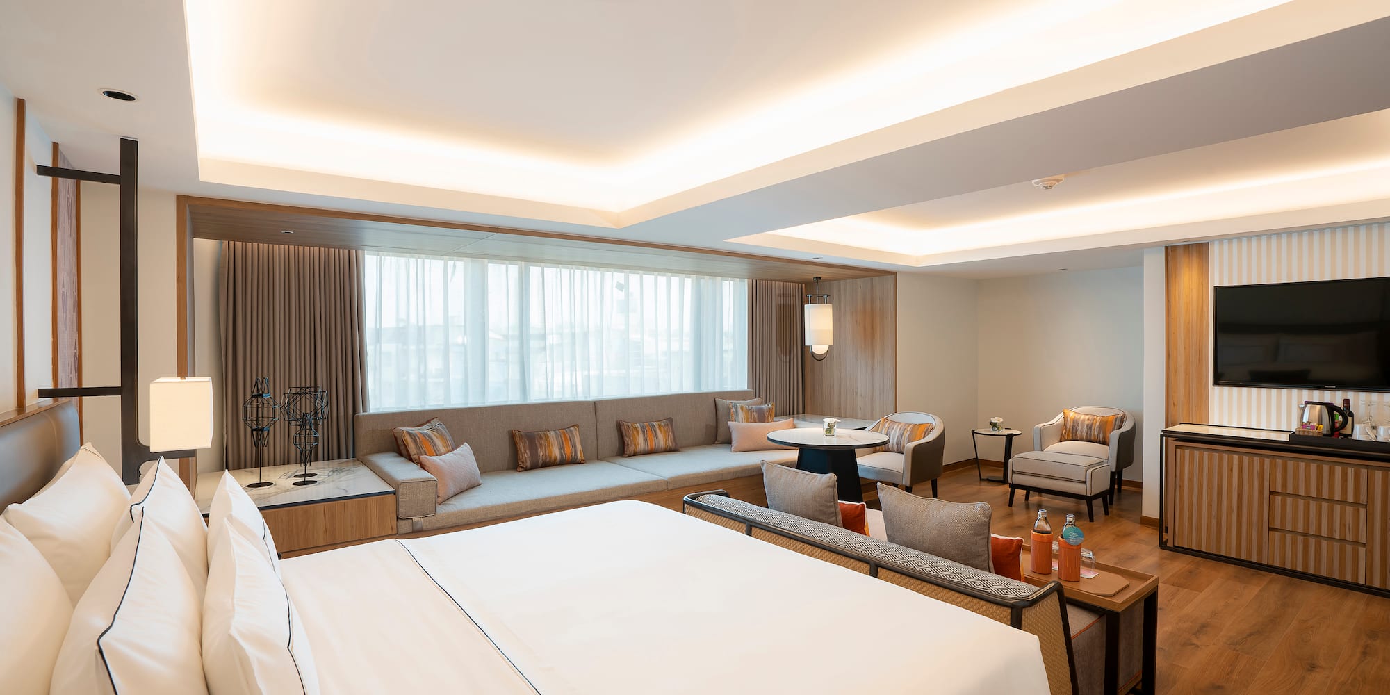 a room with a large bed and a couch