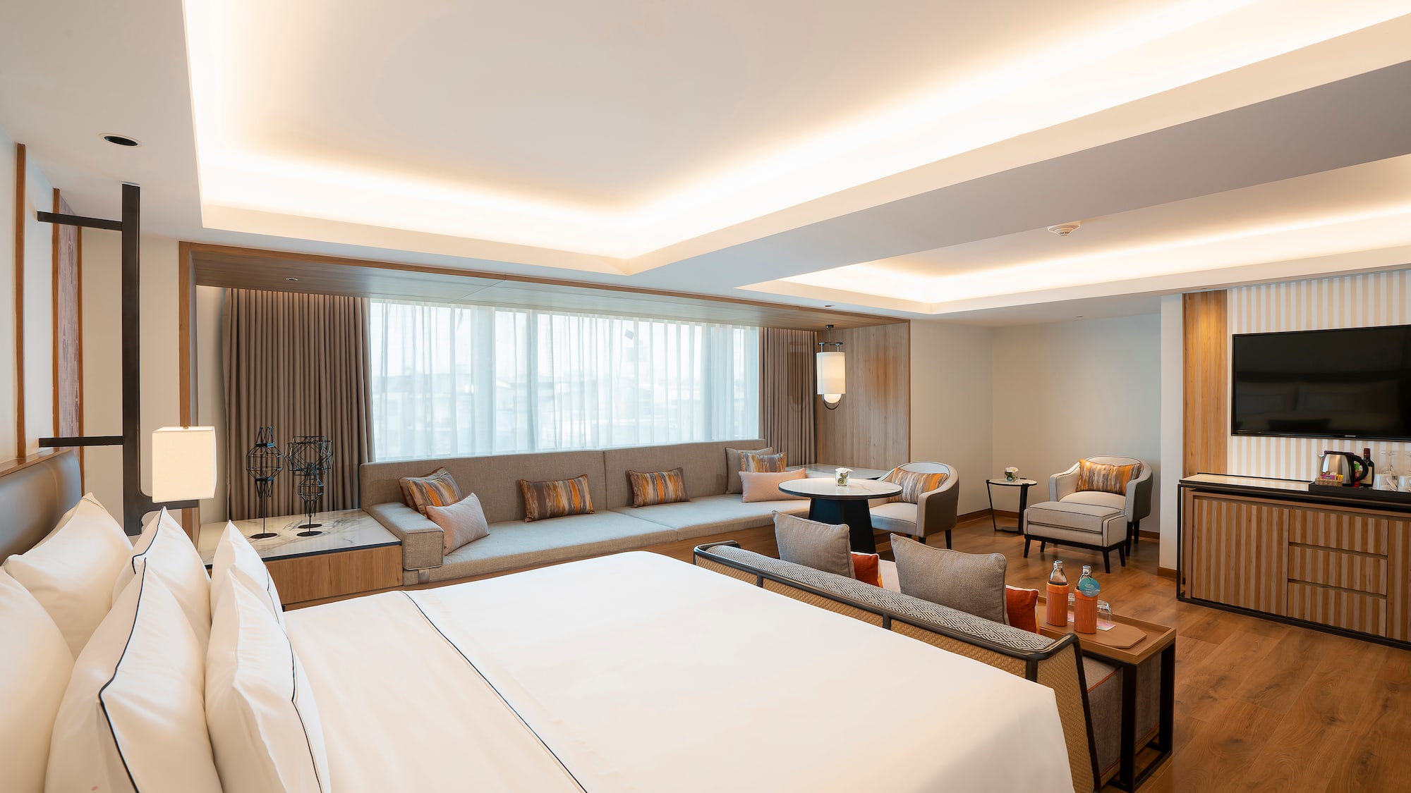 a room with a large bed and a couch