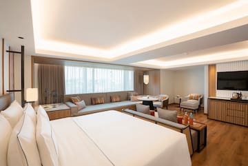 a room with a large bed and a couch