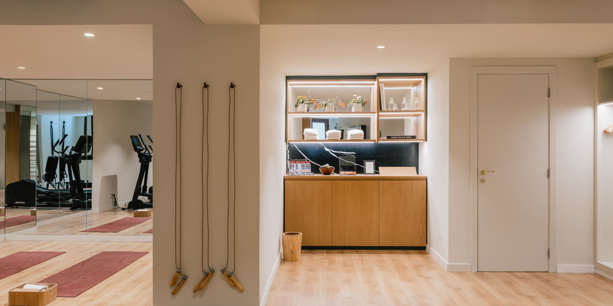 a room with a gym and exercise equipment