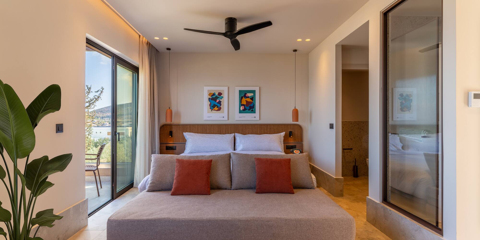 a bedroom with a bed and a ceiling fan