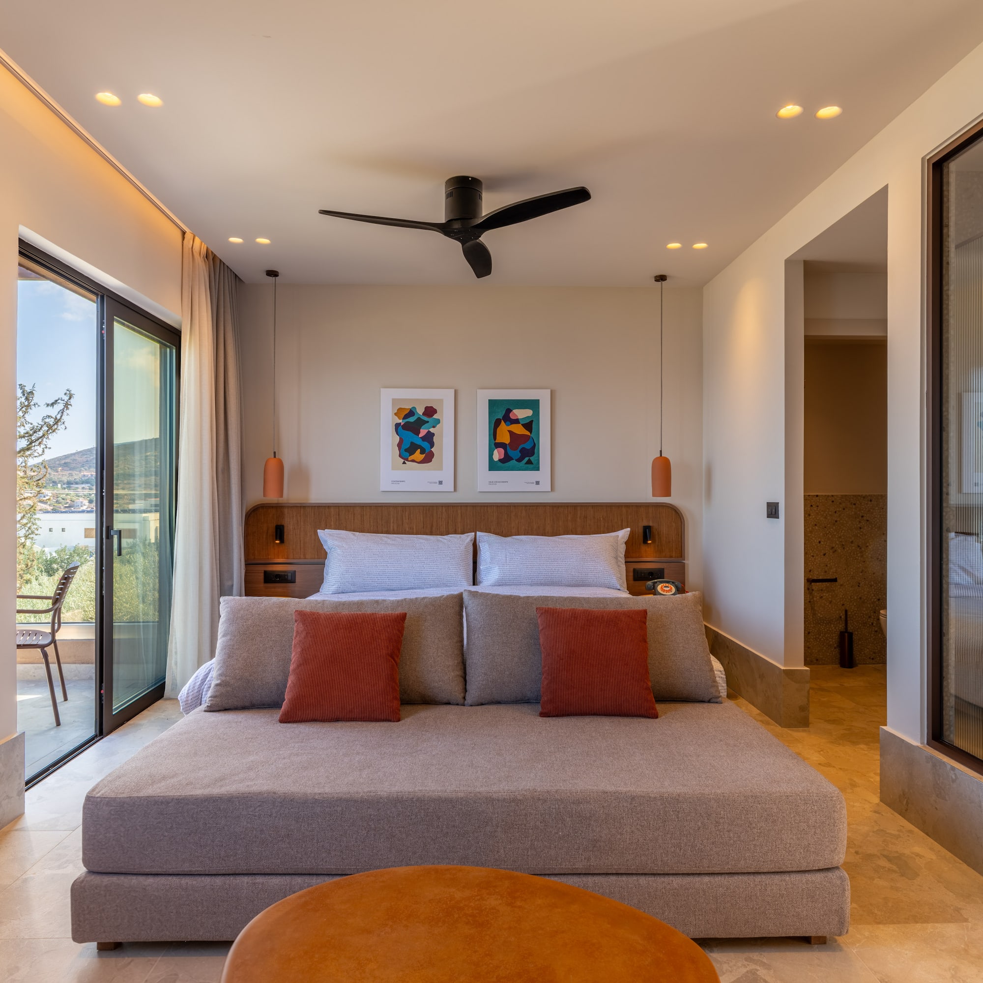 a bedroom with a bed and a ceiling fan