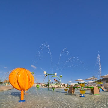 a water fountain with a ball in the water