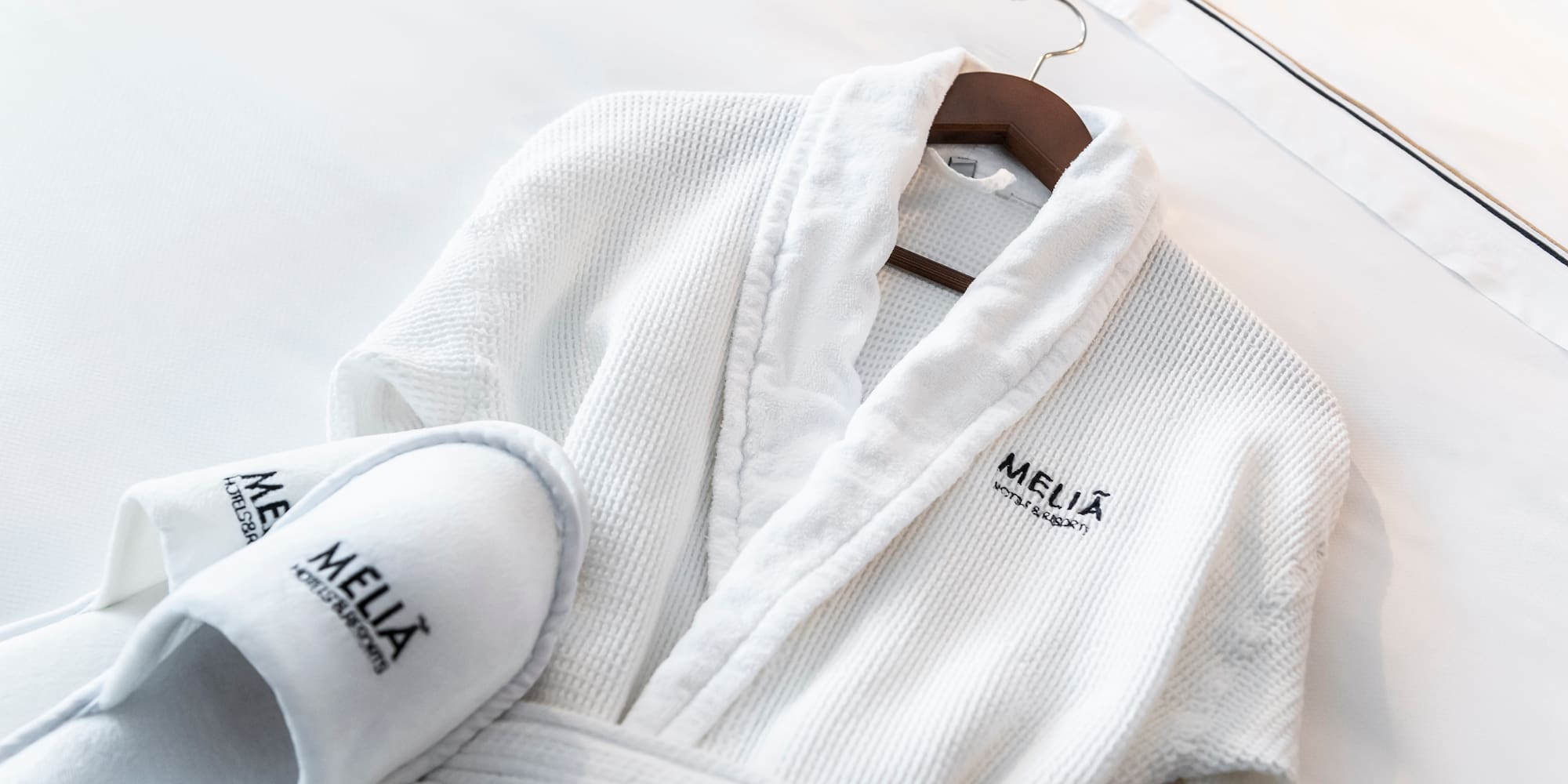 a white robe and slippers on a swinger