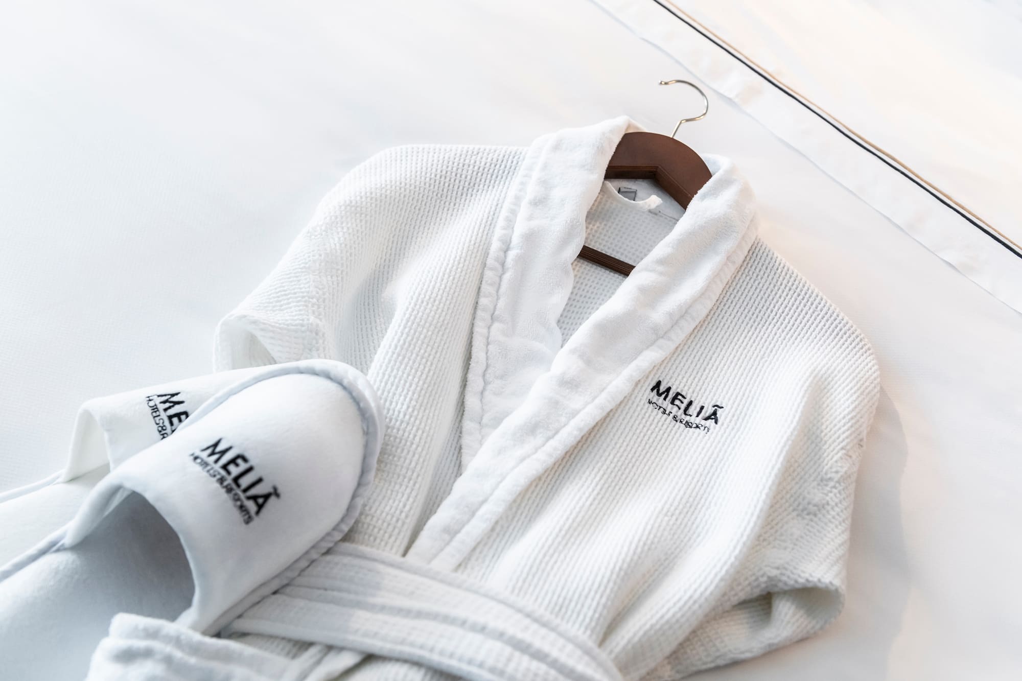 a white robe and slippers on a swinger