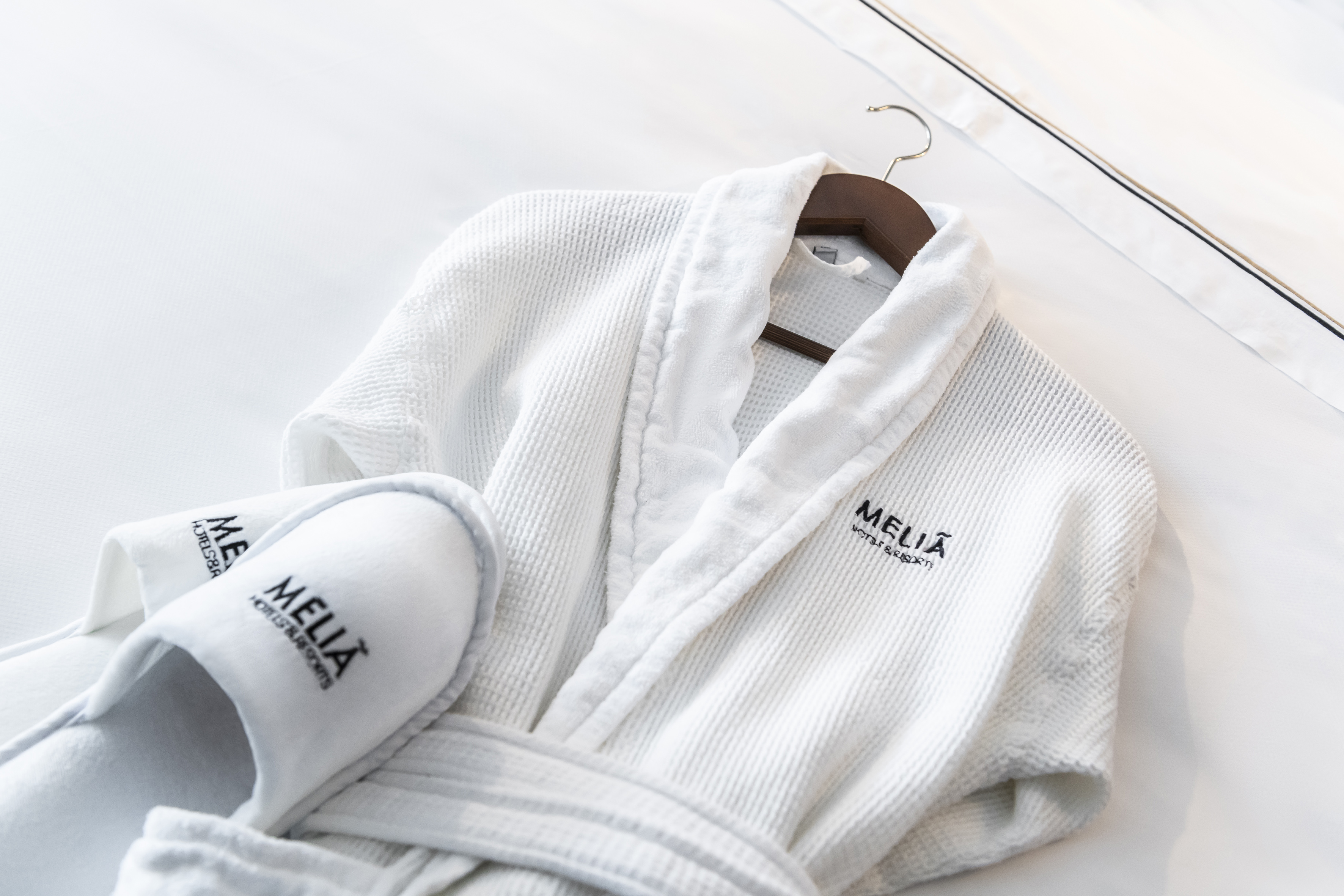 Meliá Hotels & Resorts white waffle bathrobe and slippers.