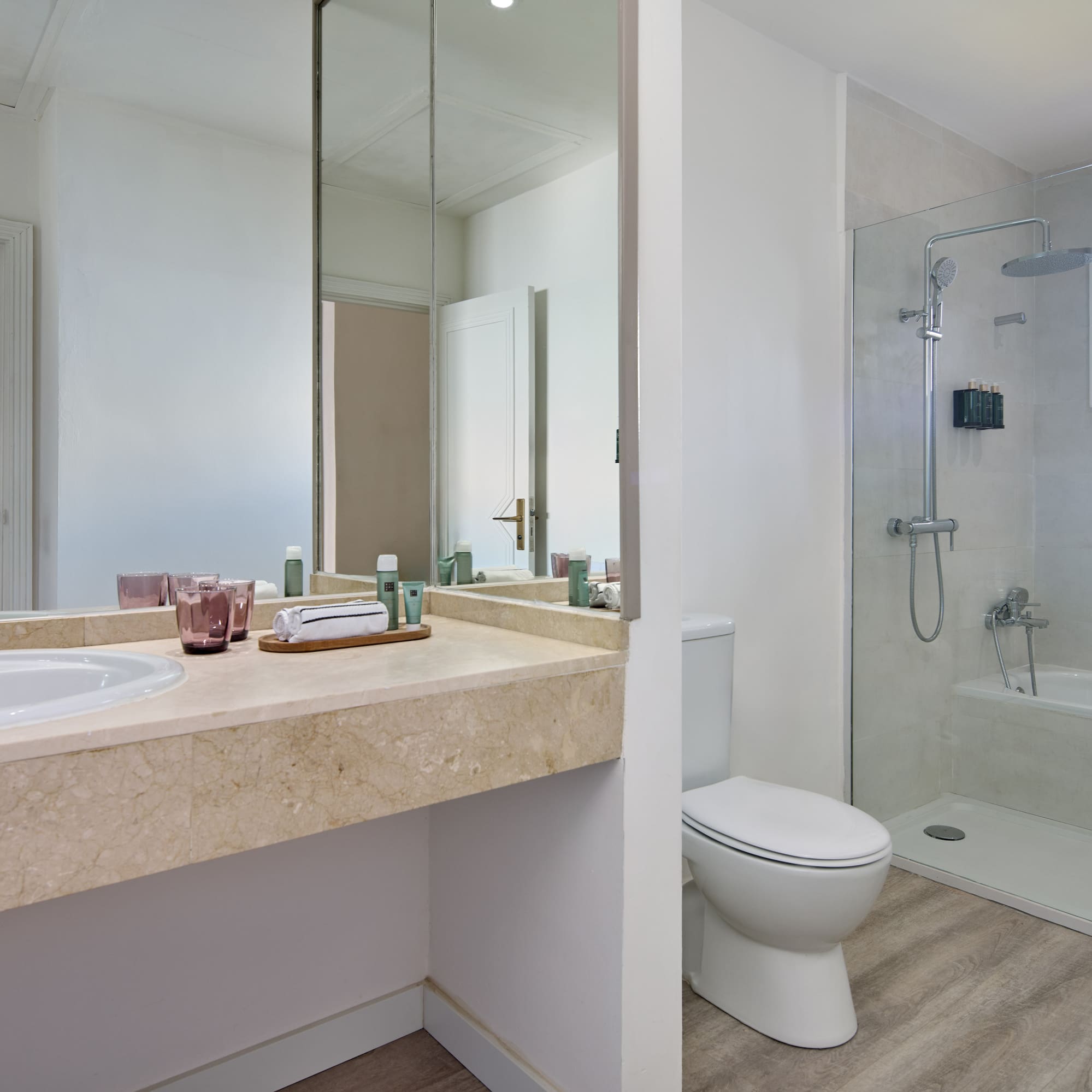 a bathroom with a shower and sink