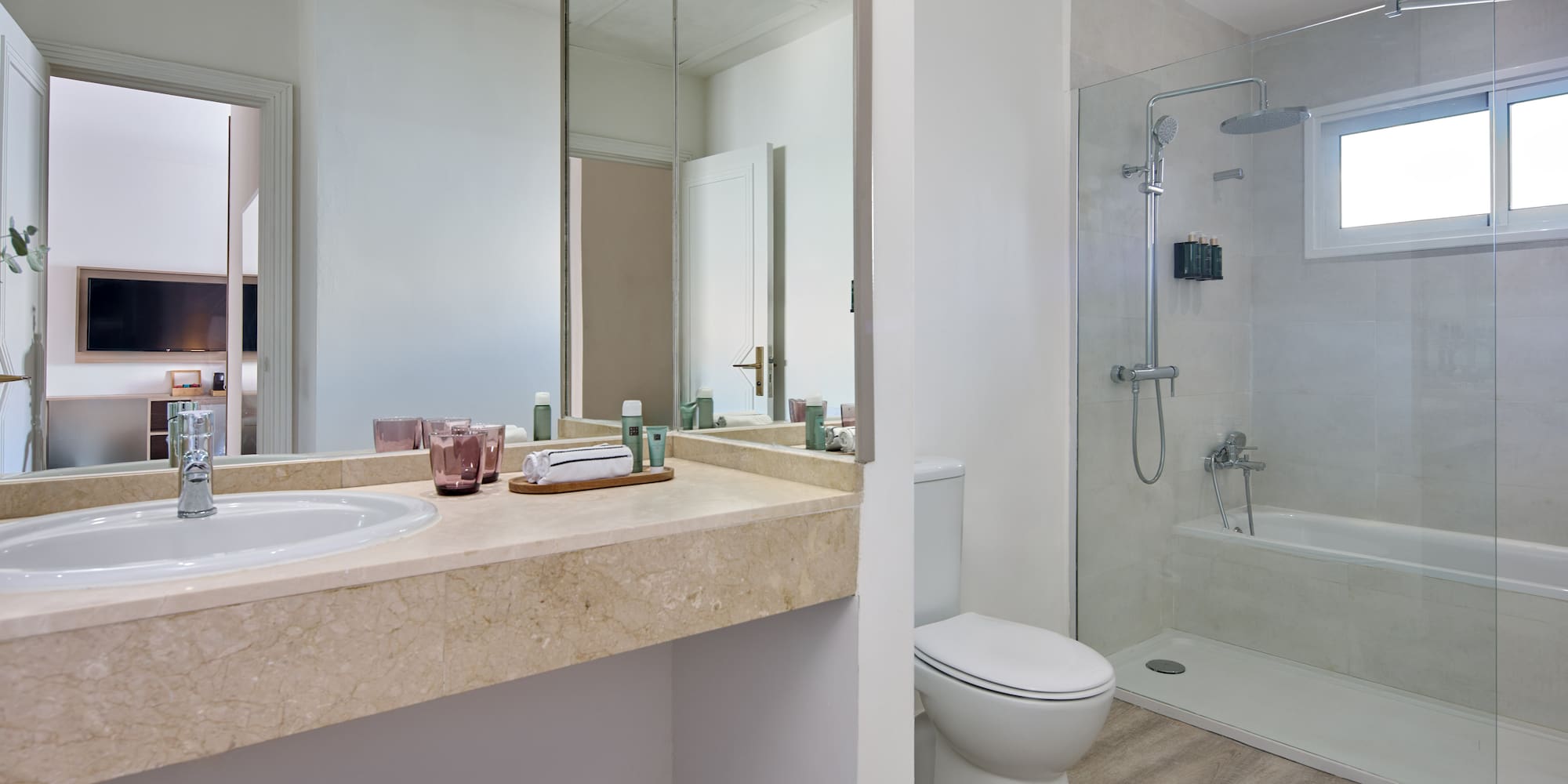 a bathroom with a shower and sink