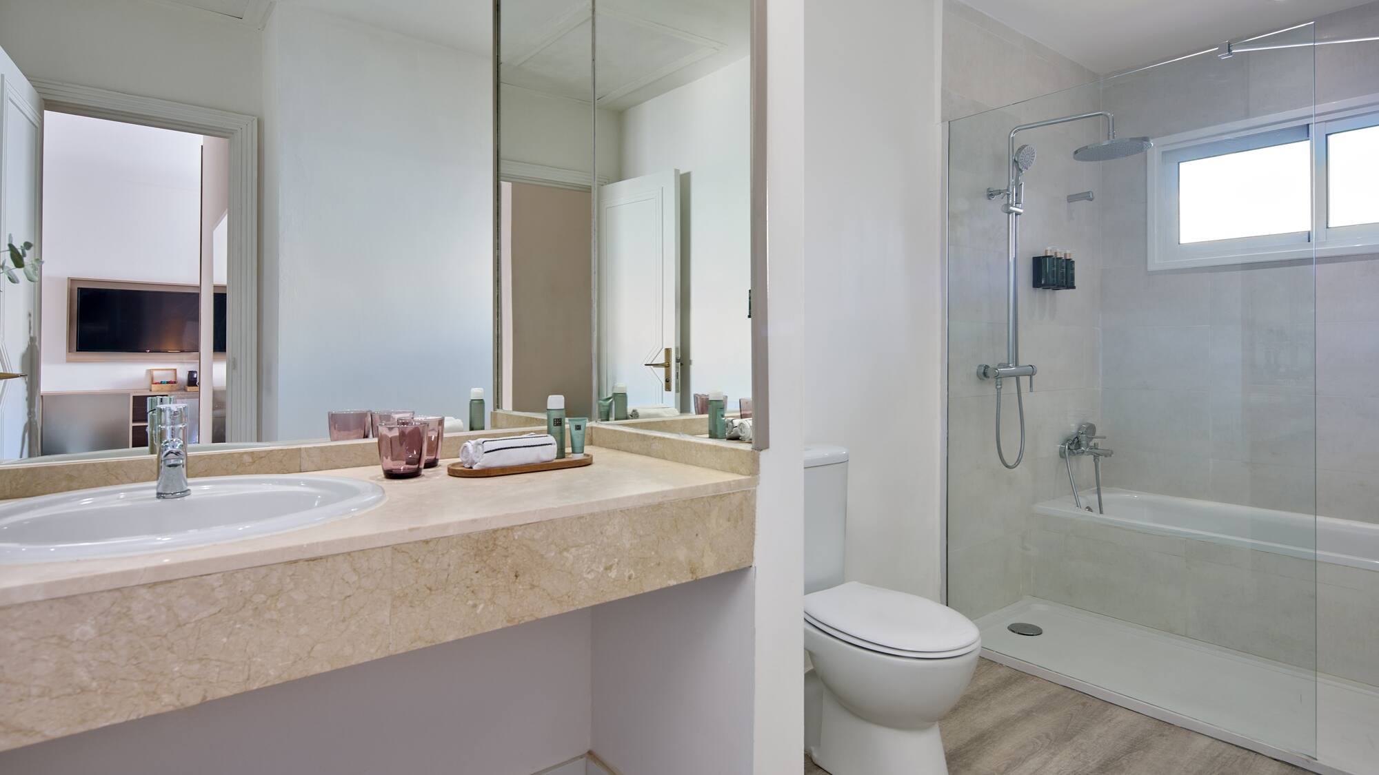 a bathroom with a shower and sink