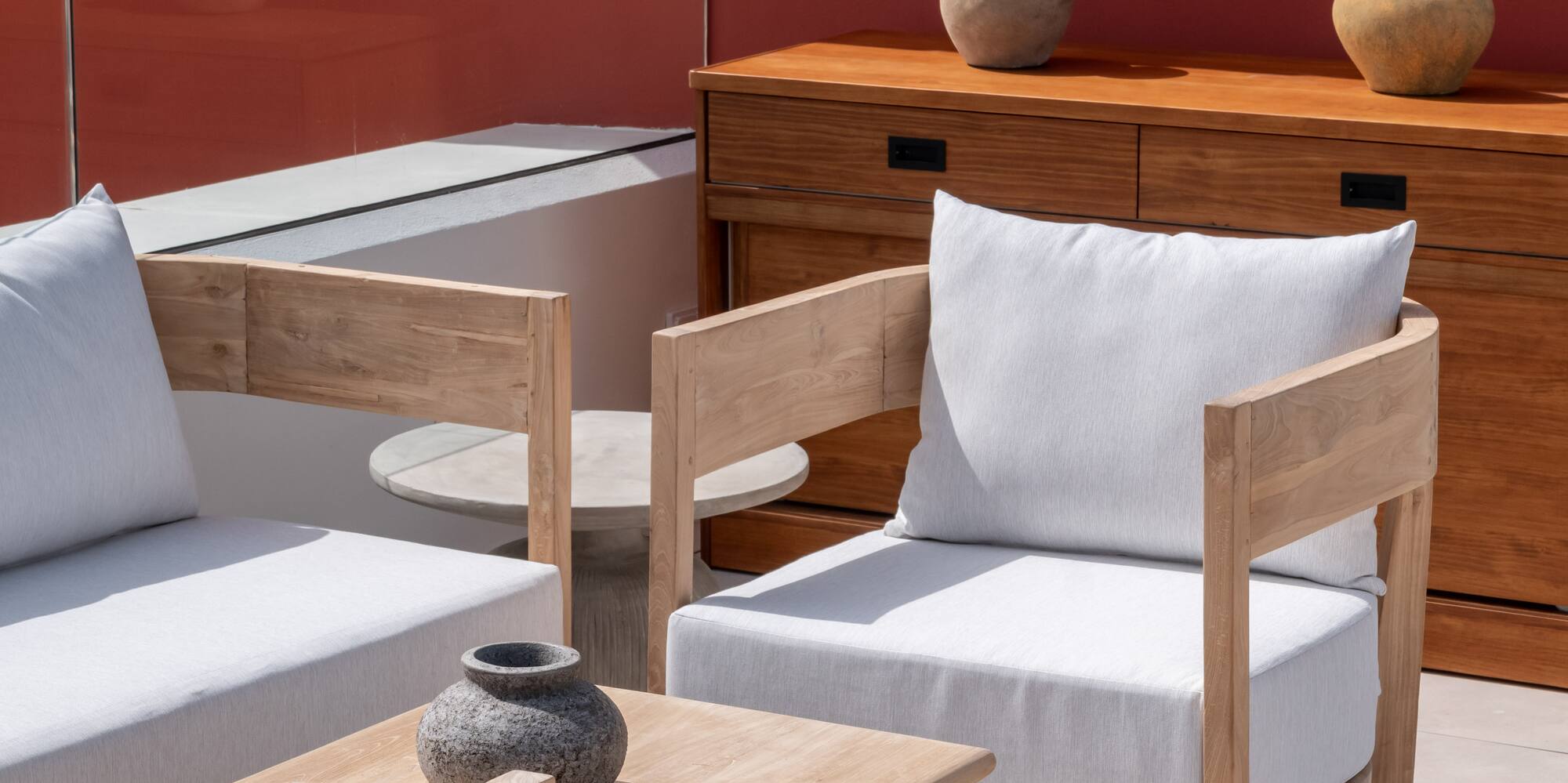 a patio with white furniture and a table