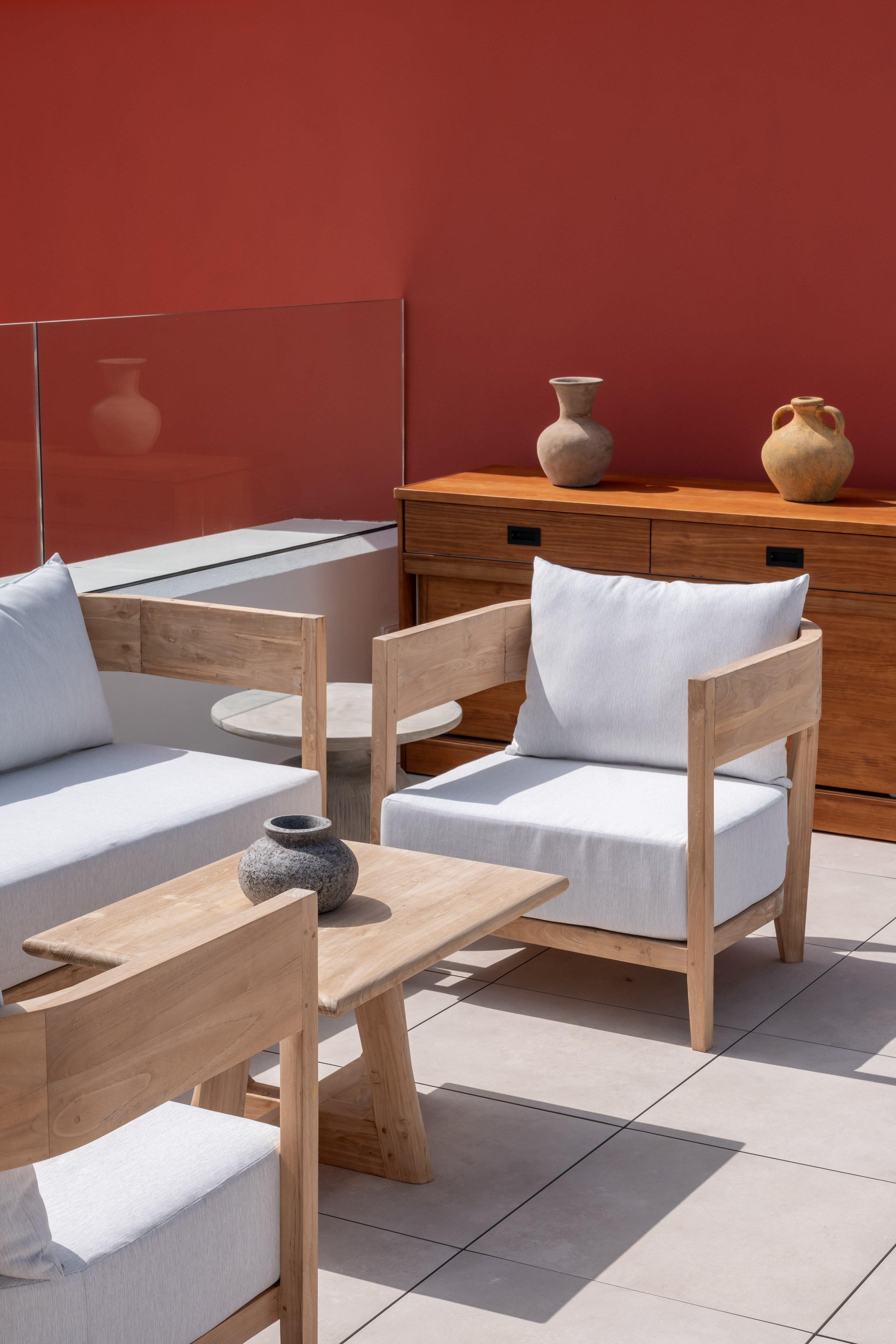 a patio with white furniture and a table