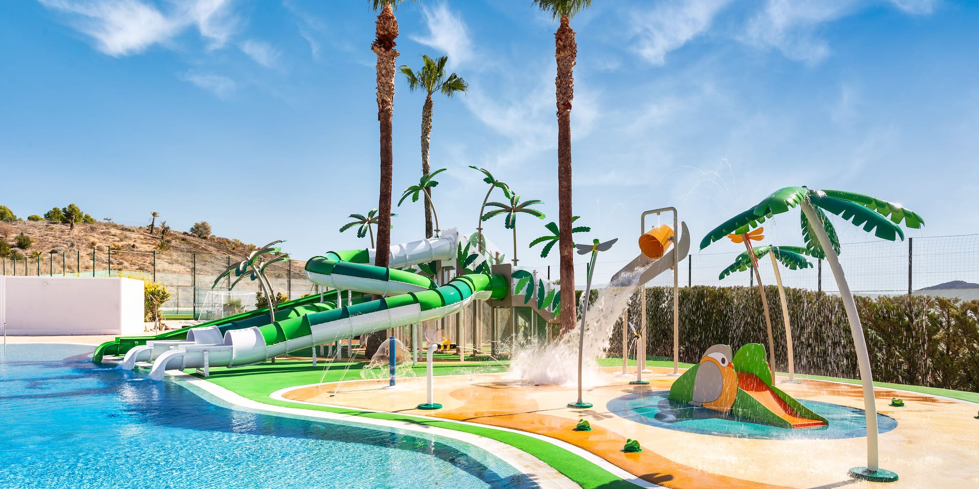 a water park with a pool and palm trees