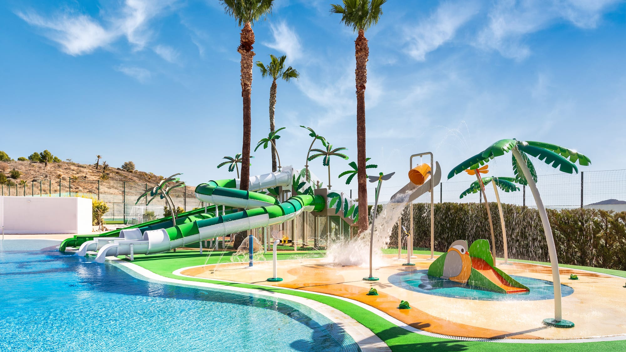 a water park with a pool and palm trees