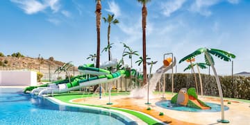 a water park with a pool and palm trees