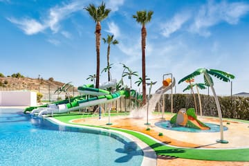 a water park with a pool and palm trees