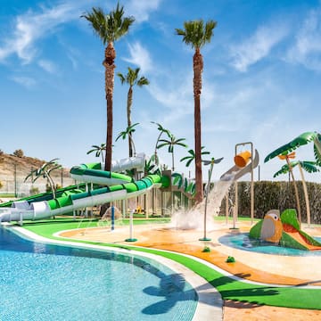a water park with a pool and palm trees