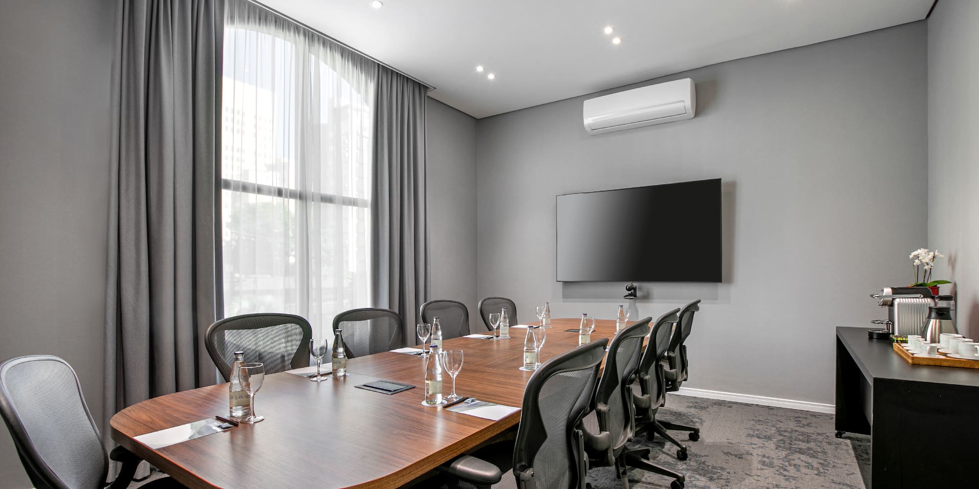 a conference room with a table and chairs