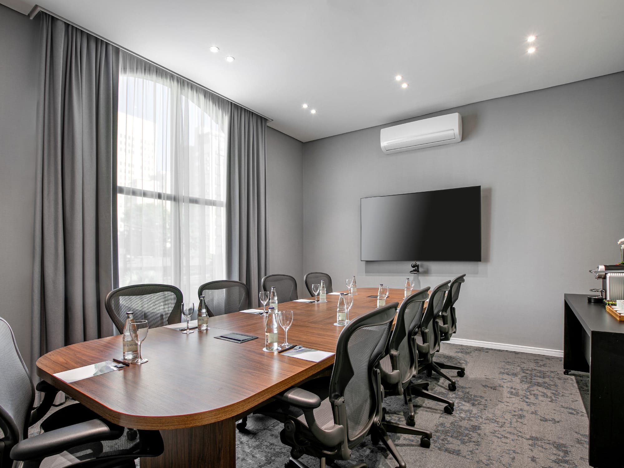 a conference room with a table and chairs