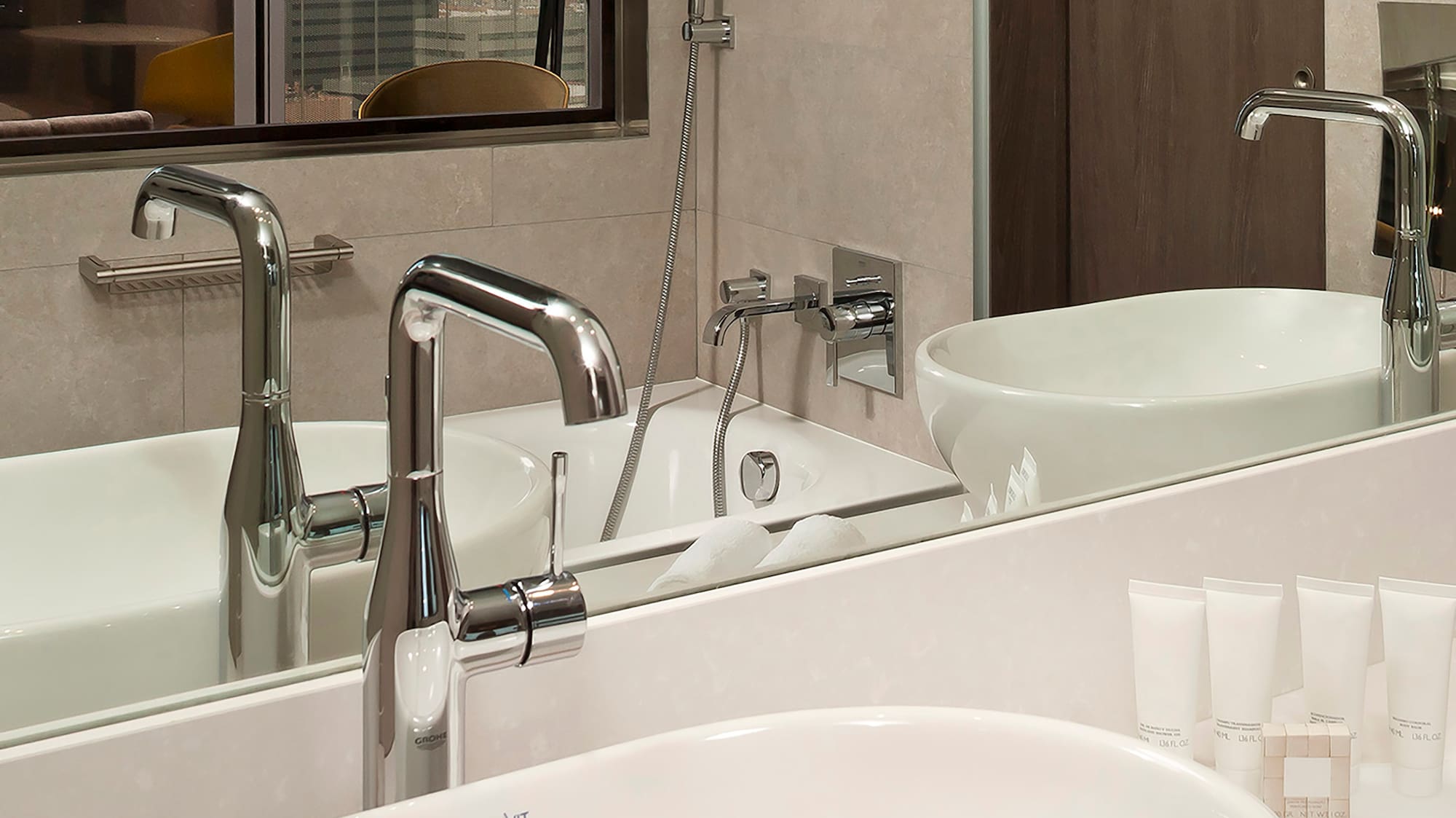 a bathroom with a sink and mirror