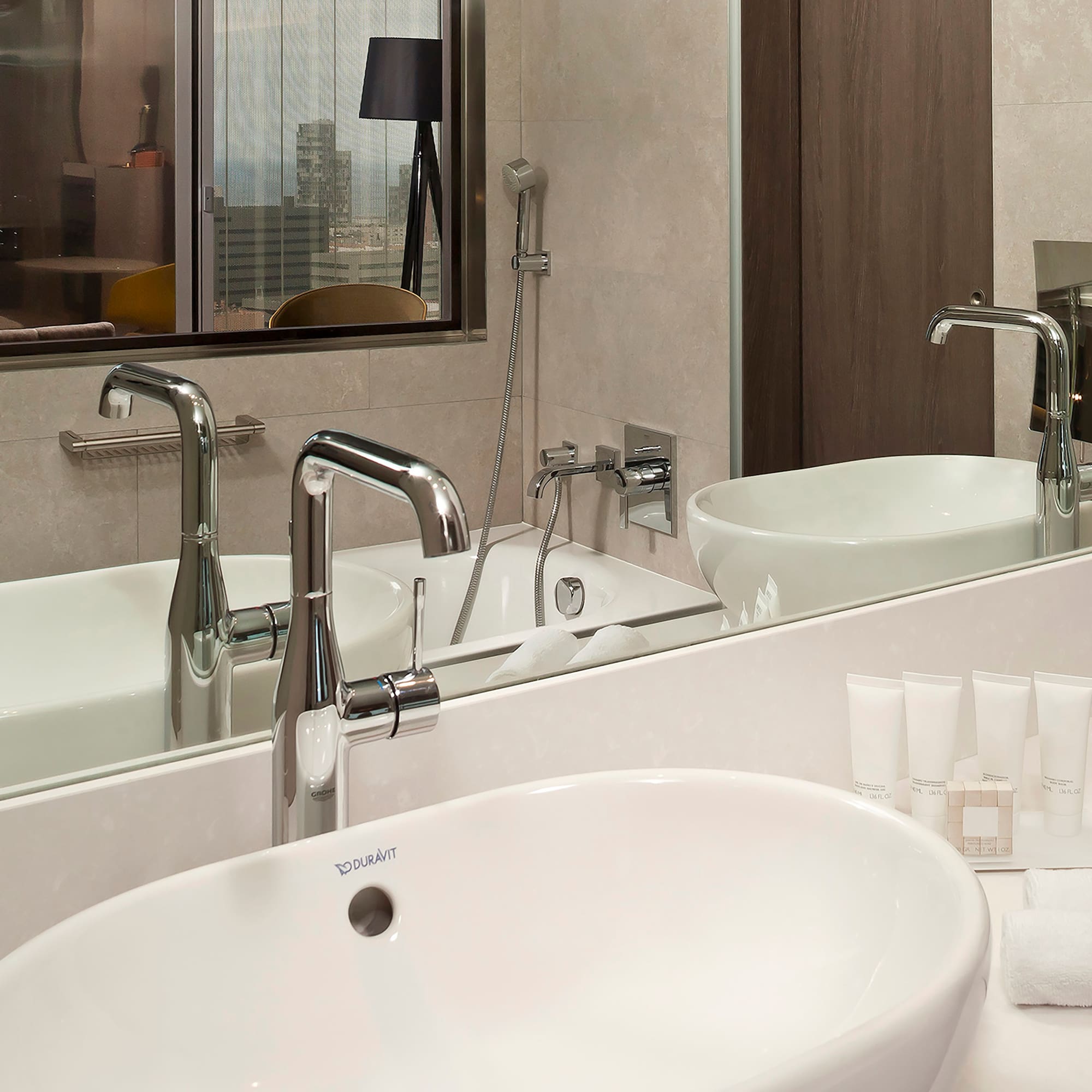 a bathroom with a sink and mirror