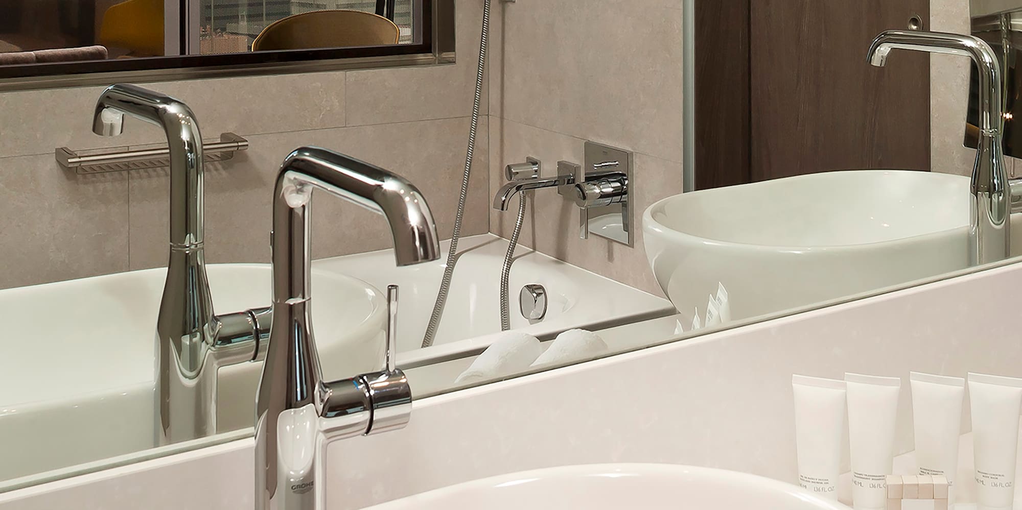 a bathroom with a sink and mirror