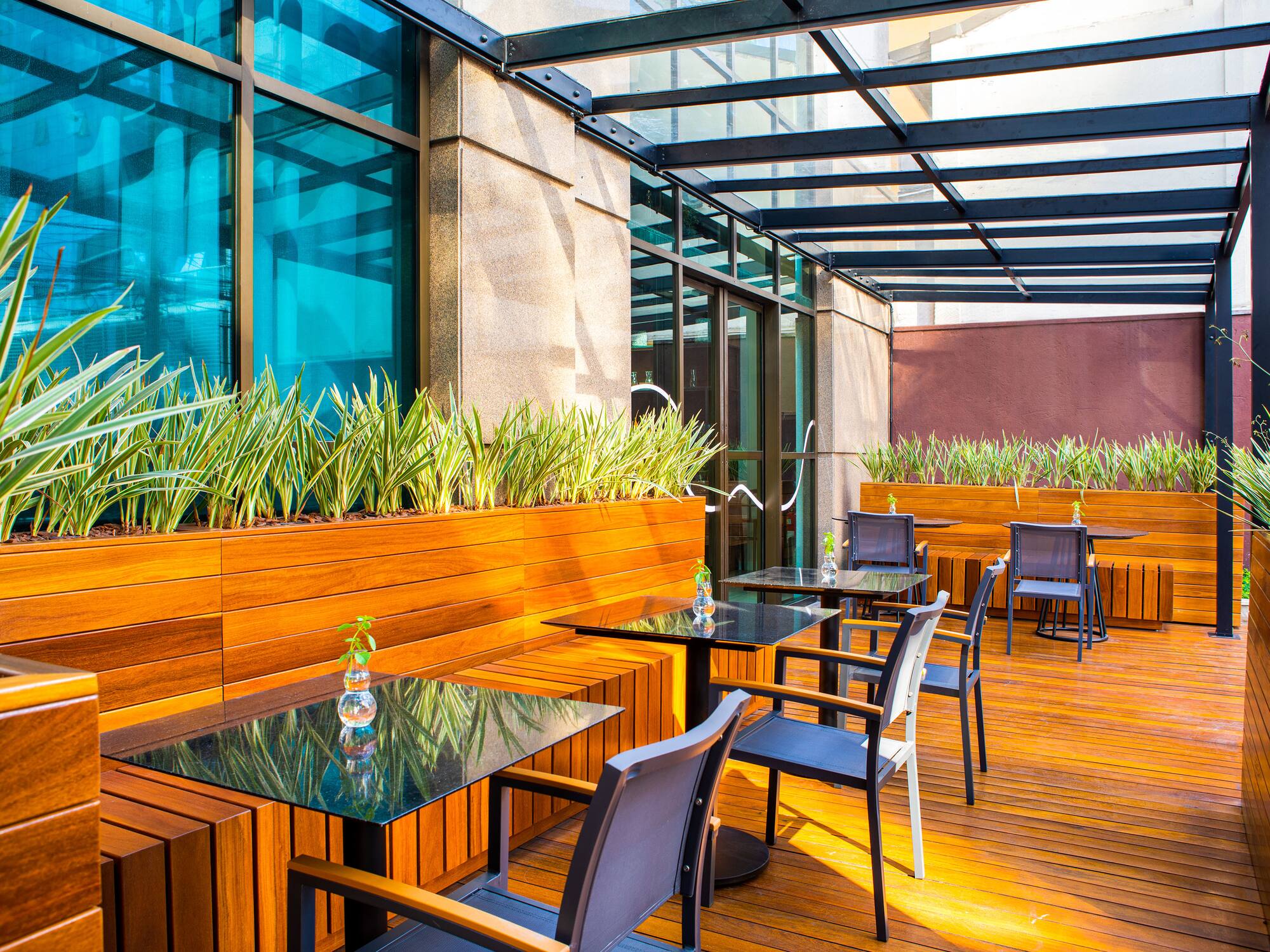 a patio with tables and chairs