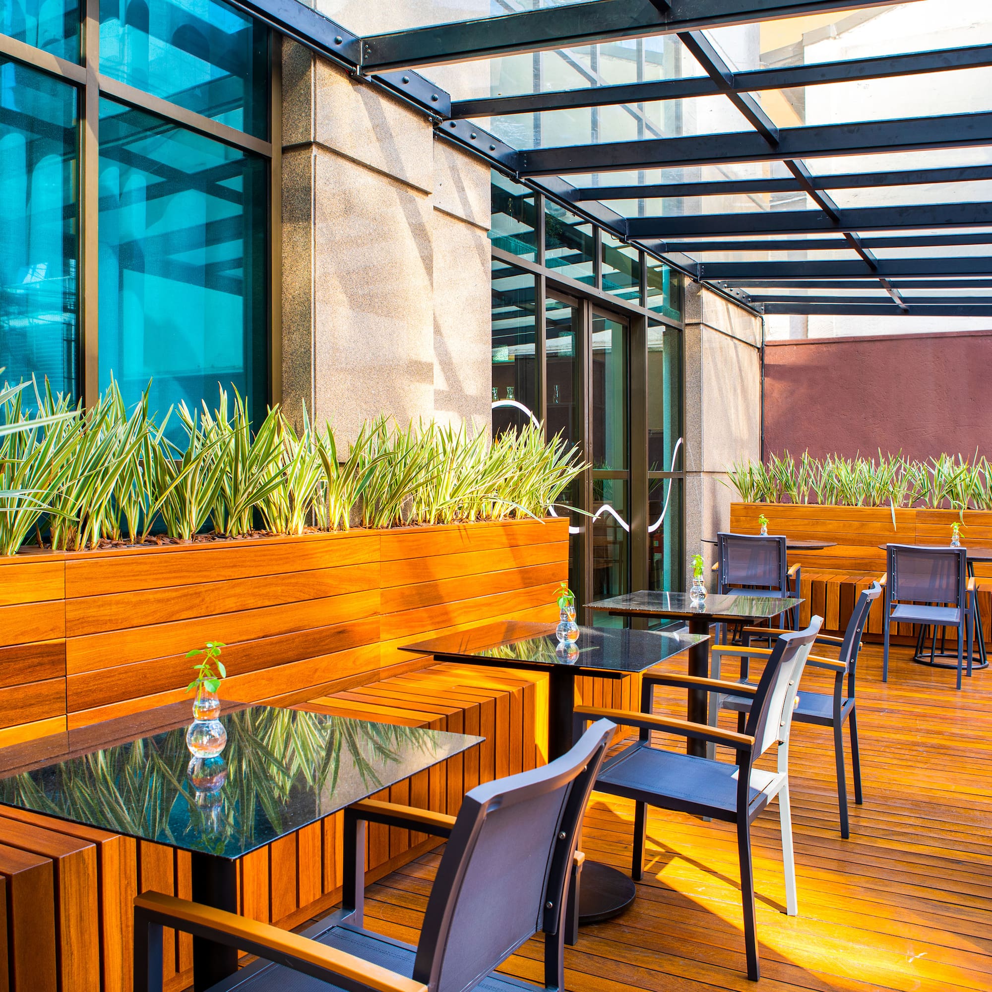 a patio with tables and chairs