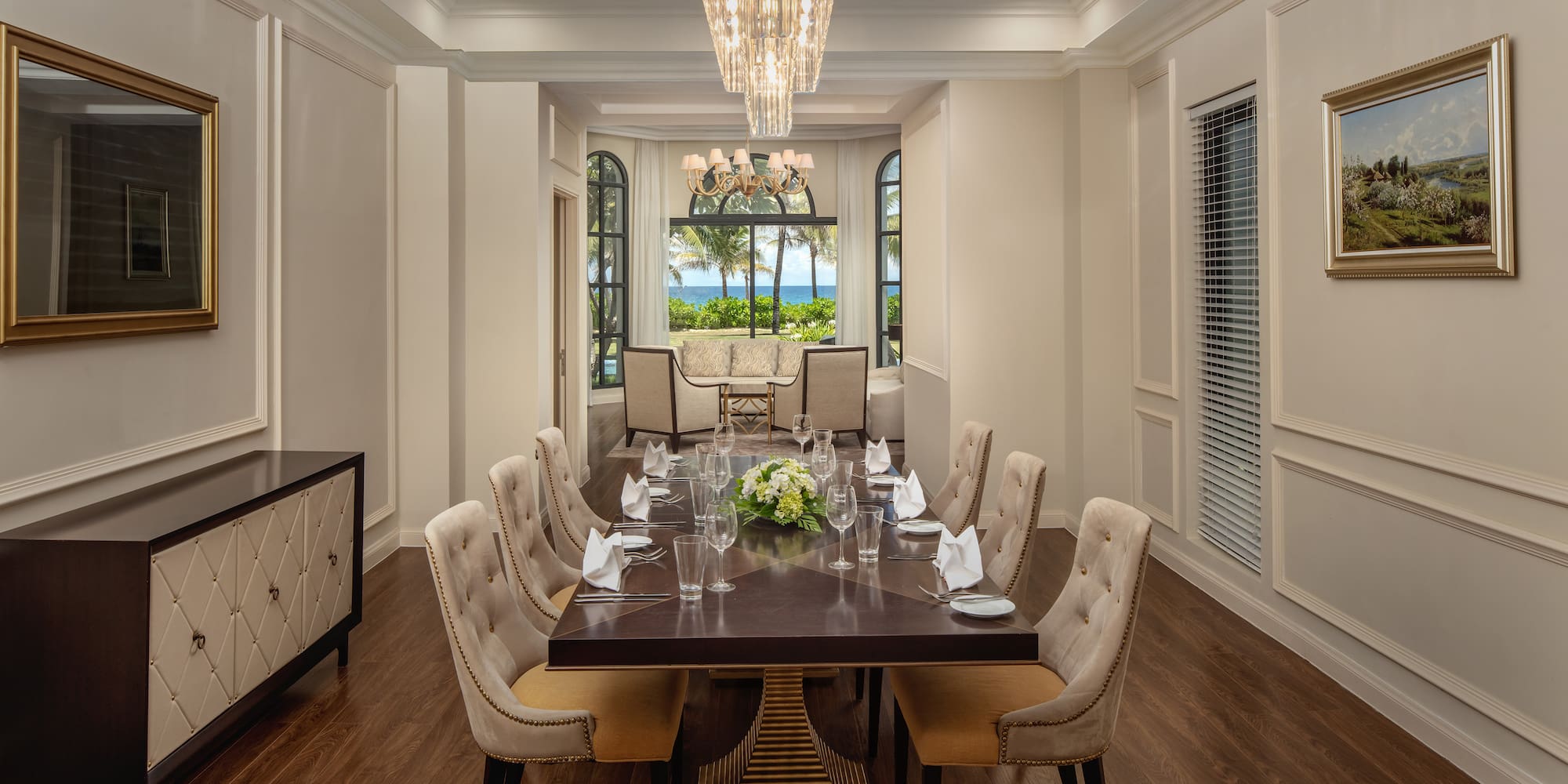 a dining room with a table and chairs