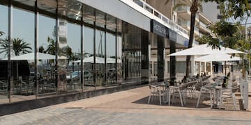 a building with tables and chairs outside