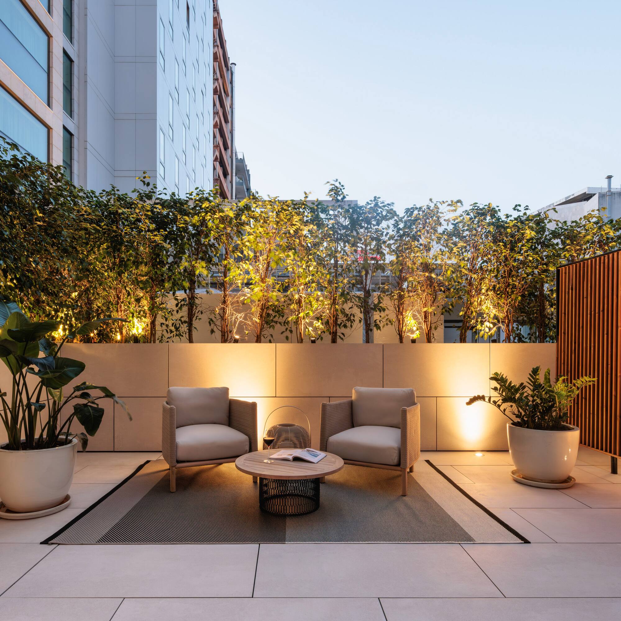 a patio with chairs and a table