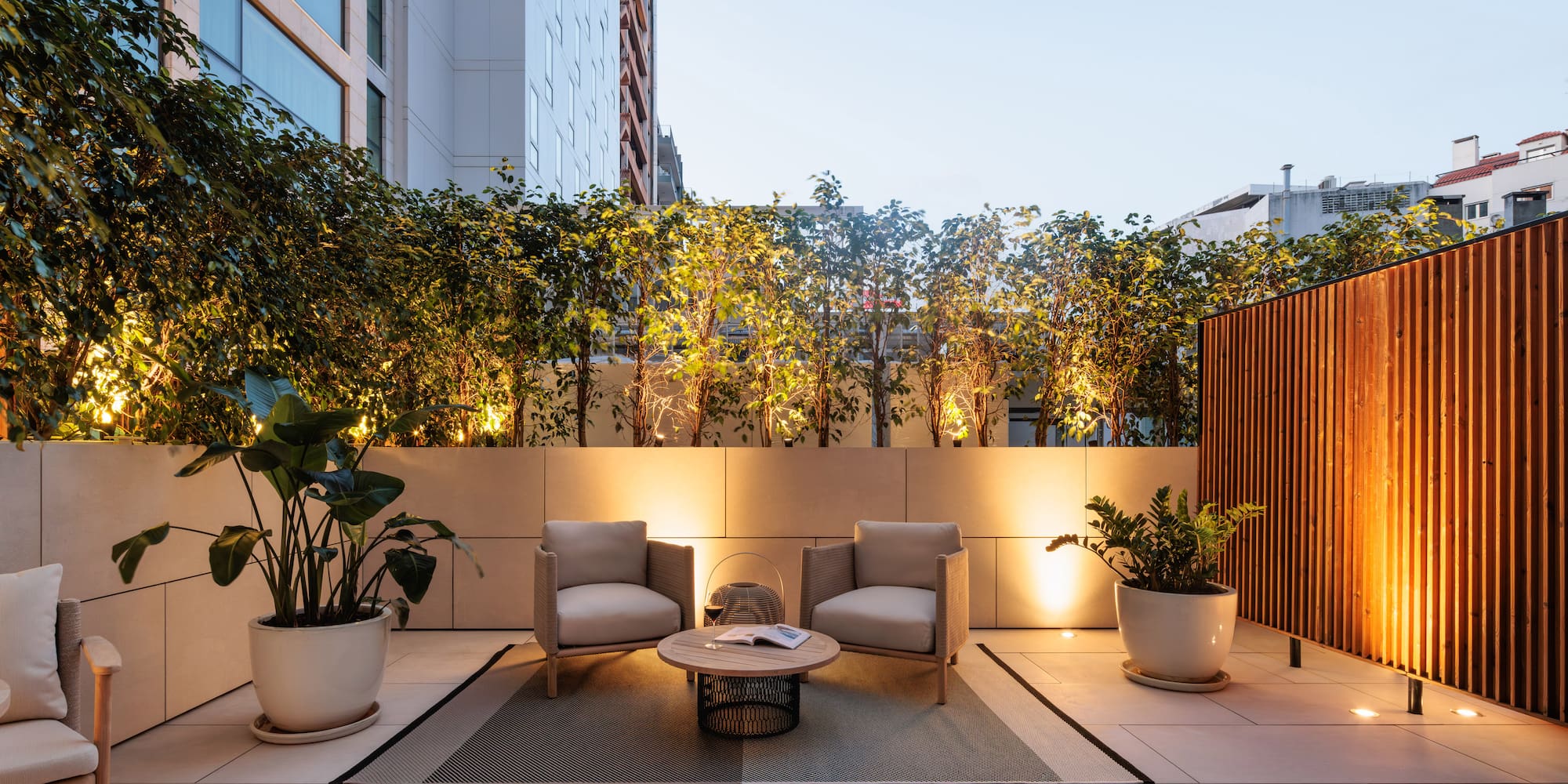 a patio with chairs and a table
