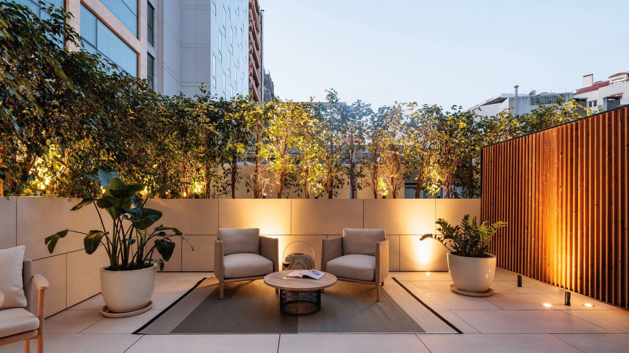 a patio with chairs and a table