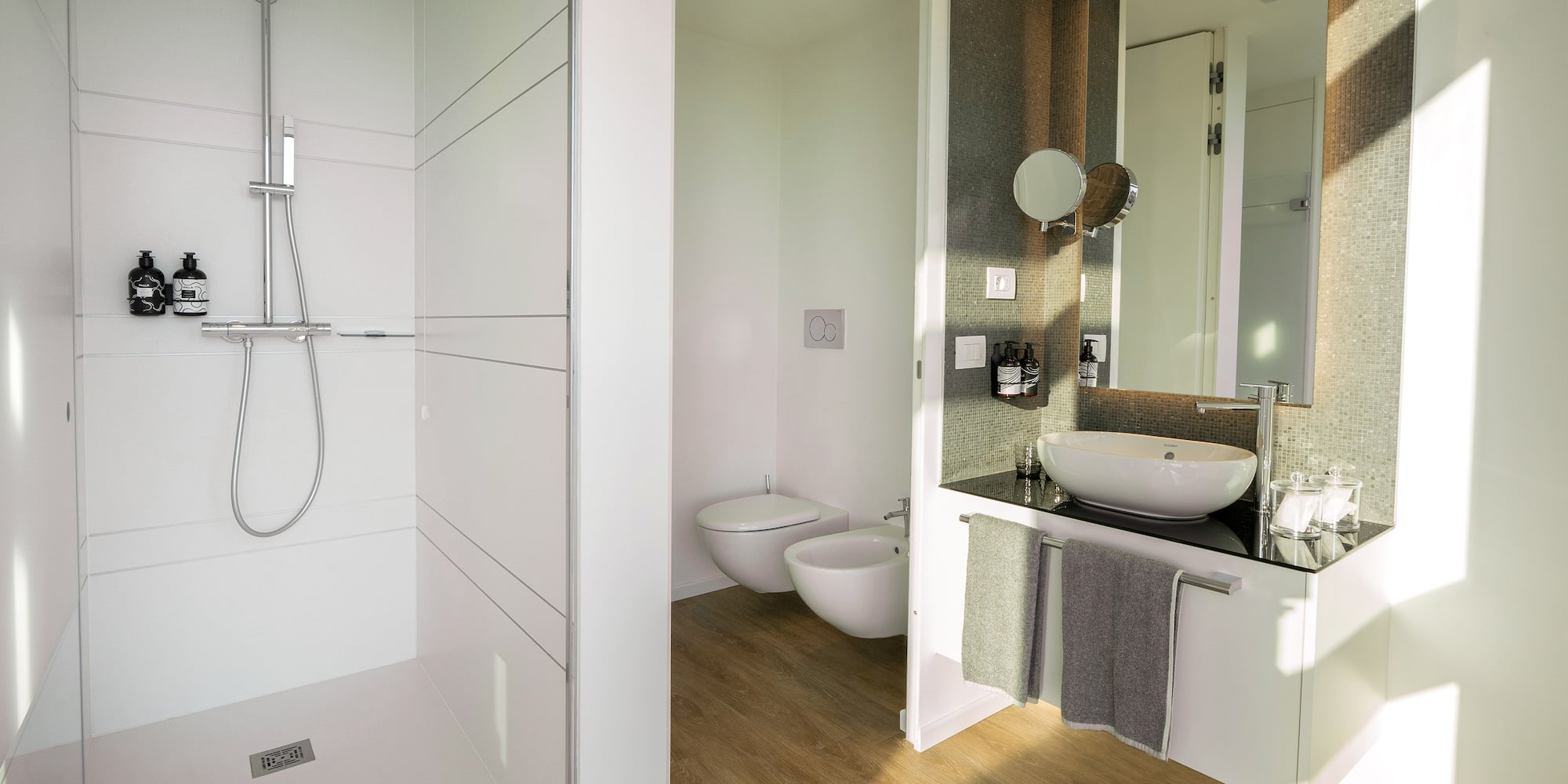 a bathroom with a shower and sink