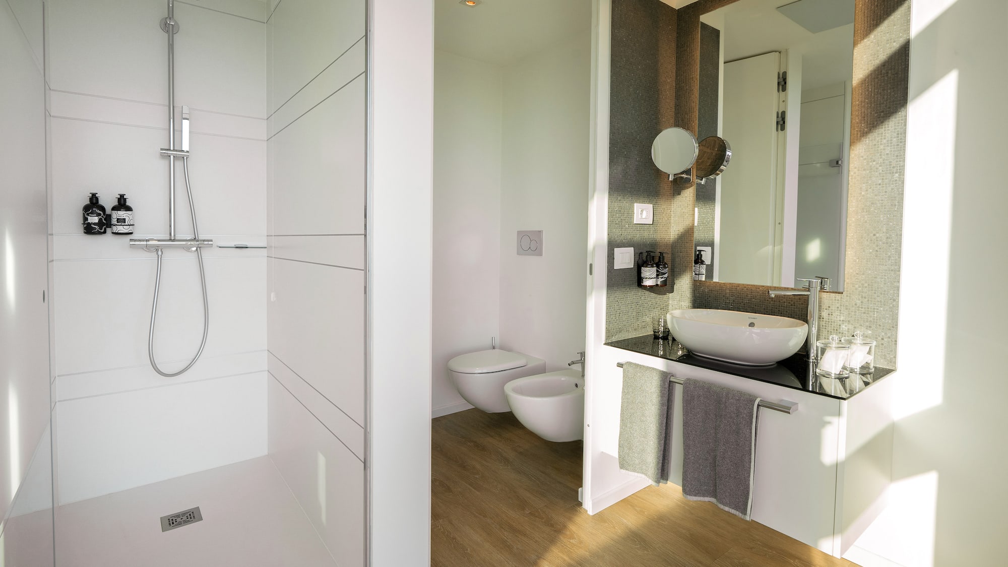 a bathroom with a shower and sink