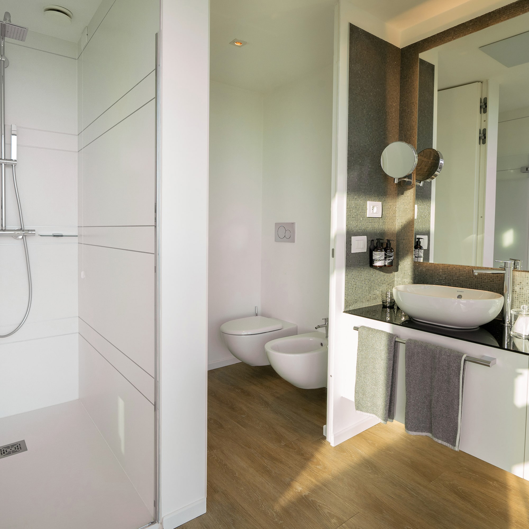 a bathroom with a shower and sink