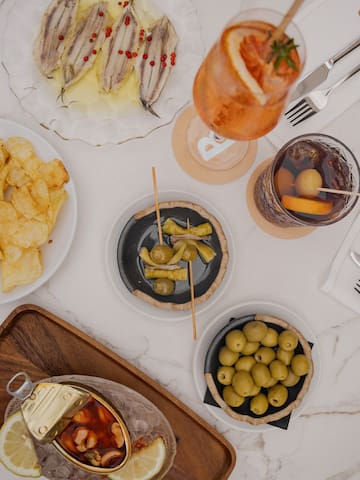 a table with plates of food and drinks
