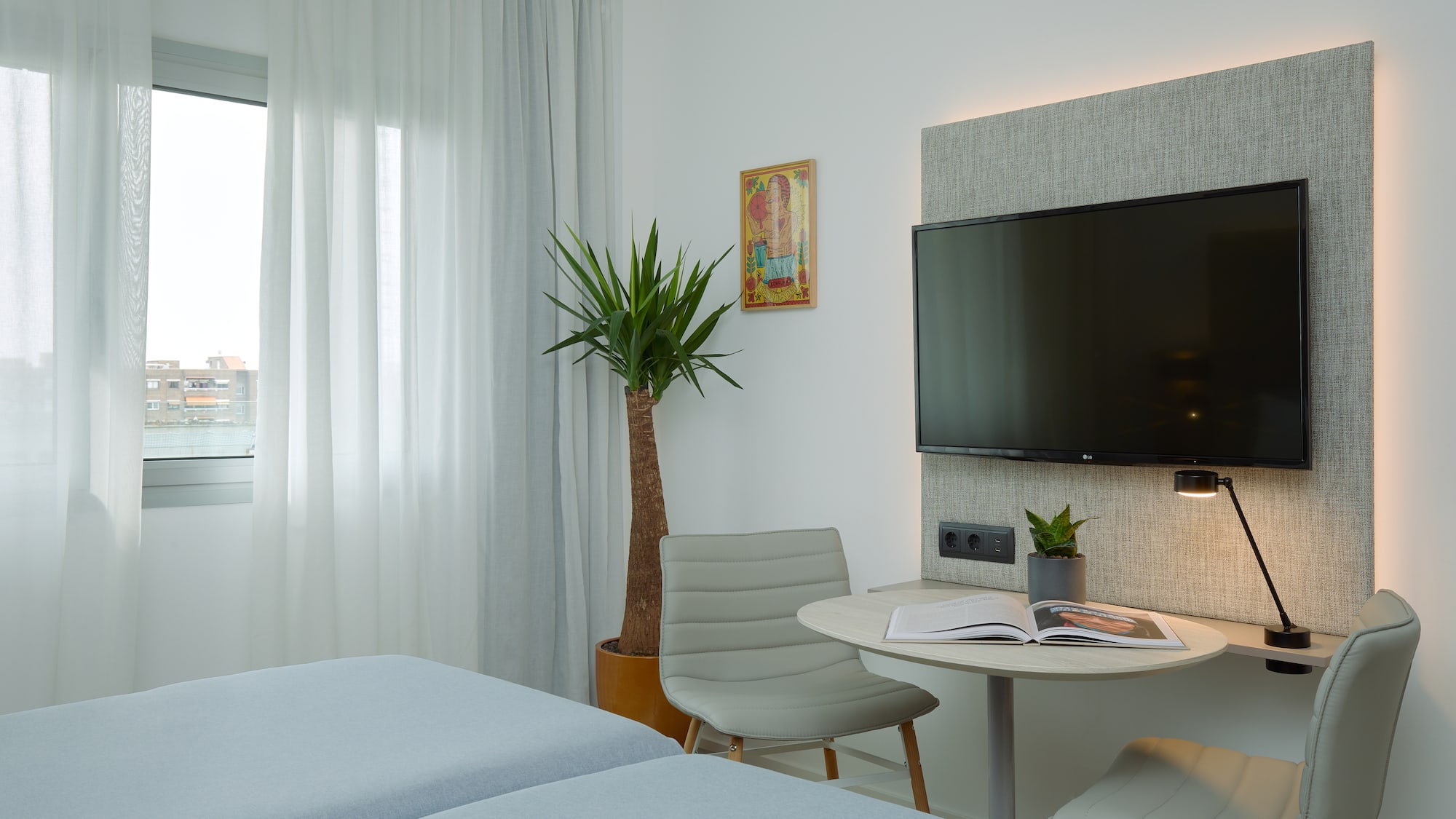 a room with a tv and a table