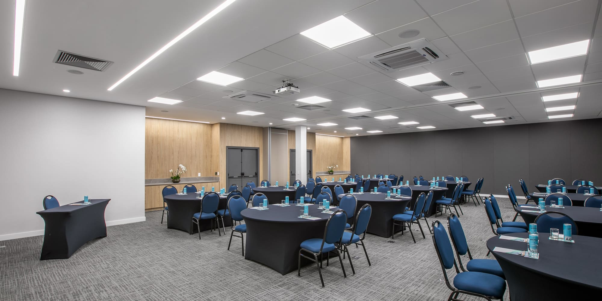 a room with round tables and chairs