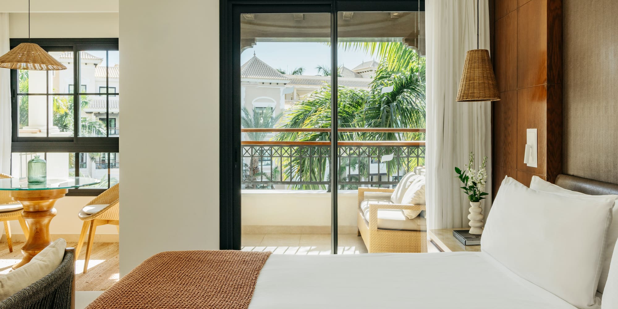 a bed with a brown blanket and a brown lamp